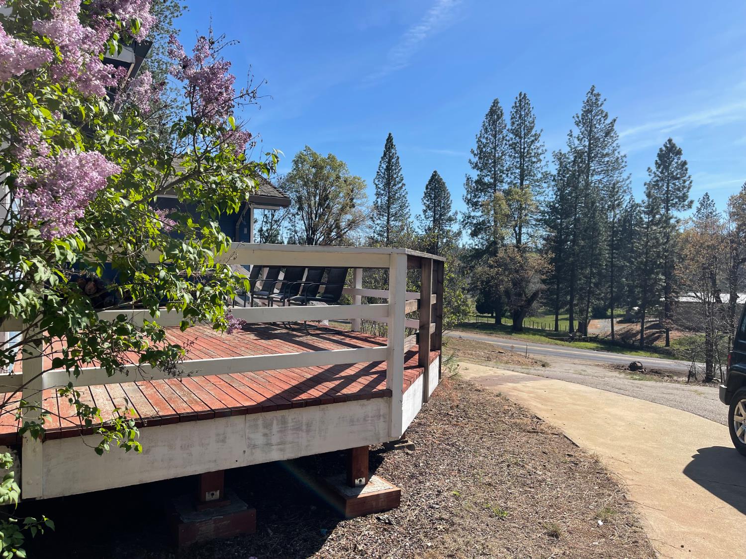 10658 Dexter Road Coulterville, CA 95311 - Photo 2 of 4 a wooden bench sitting in front of a building