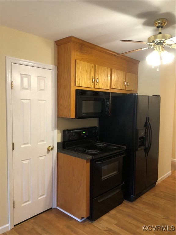 13606 Halifax Road Richmond, VA 23238 - Photo 23 of 50 Kitchen featuring range, ceiling fan, brown cabine