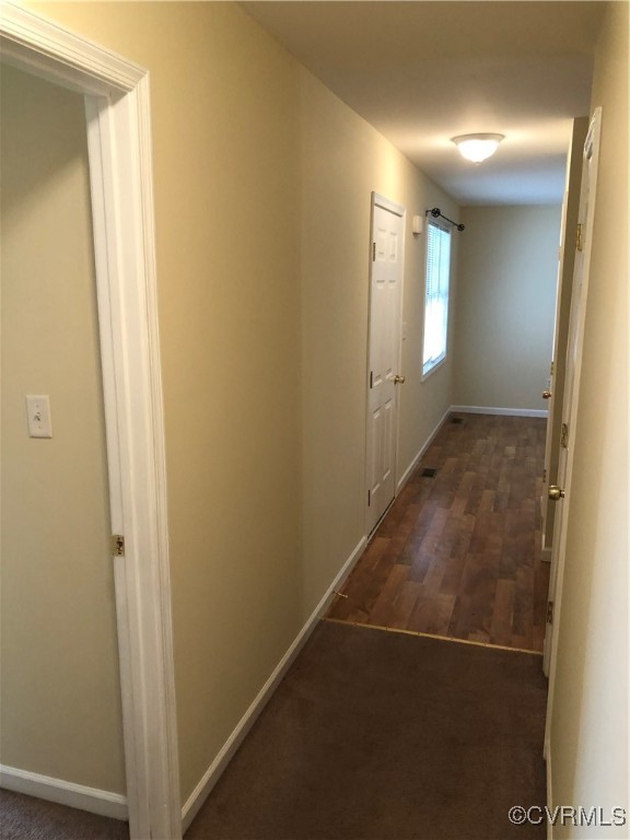 13606 Halifax Road Richmond, VA 23238 - Photo 44 of 50 Hall with baseboards and dark wood-type flooring