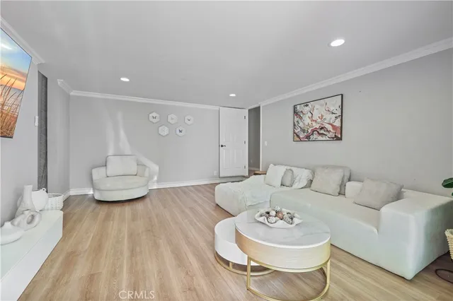 a living room with furniture and a white walls