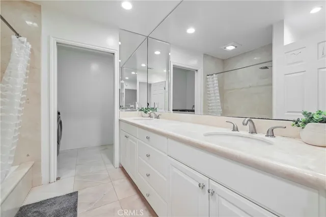 a bathroom with a double vanity sink mirror and double