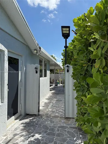 a view of a house with a tree