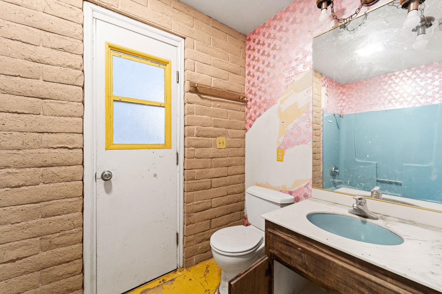 15595 Highway 16 Capay, CA 95607 - Photo 16 of 68 a bathroom with a sink a toilet and mirror