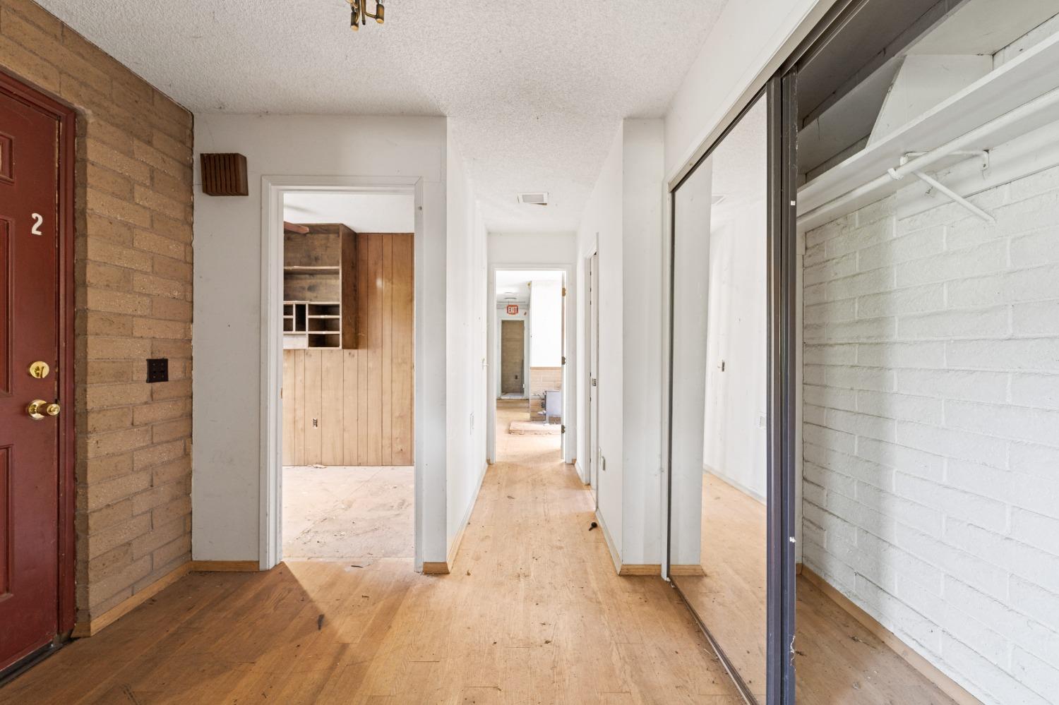 15595 Highway 16 Capay, CA 95607 - Photo 20 of 68 a view of a hallway with wooden floor and bathroom