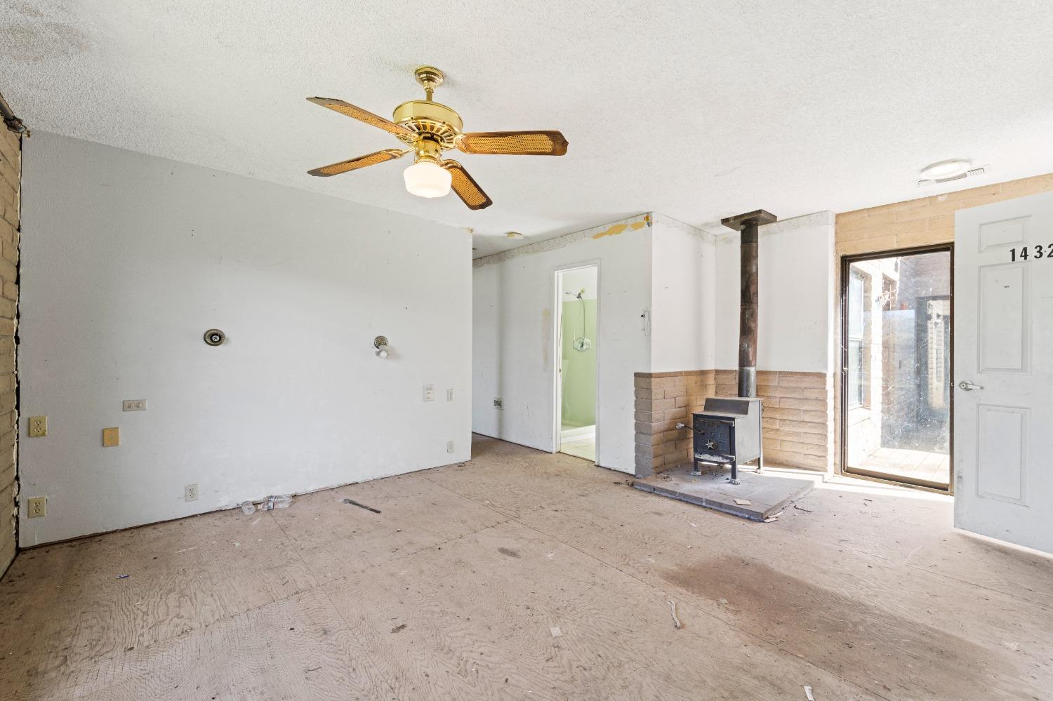 15595 Highway 16 Capay, CA 95607 - Photo 24 of 68 a view of a livingroom with a furniture a ceiling fan and a window
