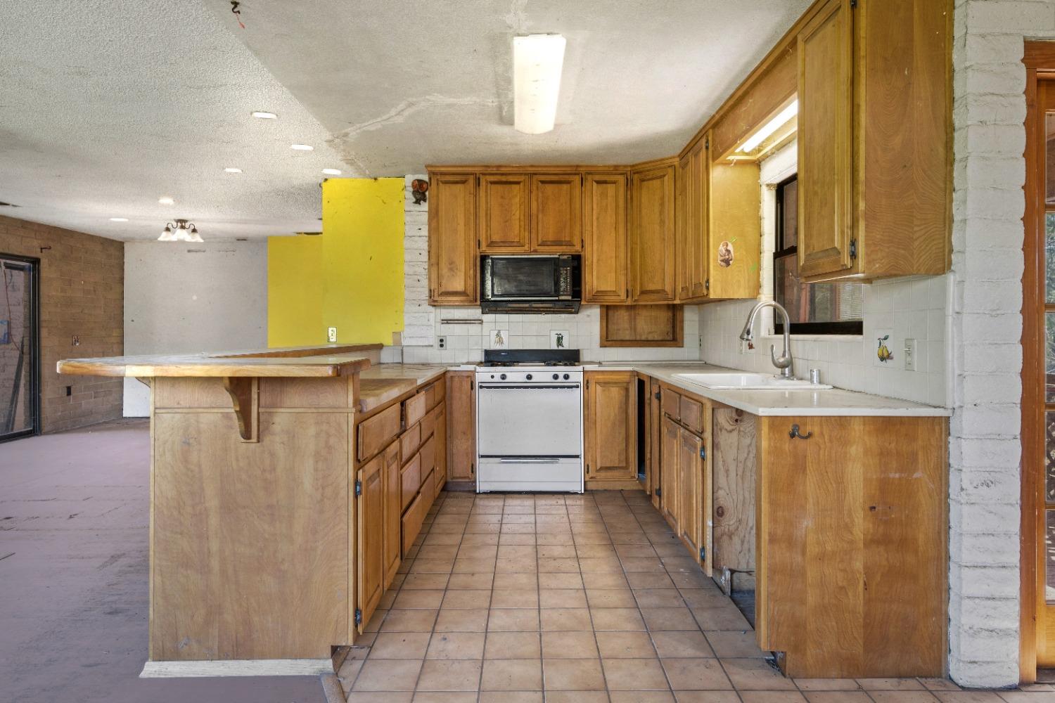 15595 Highway 16 Capay, CA 95607 - Photo 3 of 68 a kitchen with stainless steel appliances a sink stove and cabinets