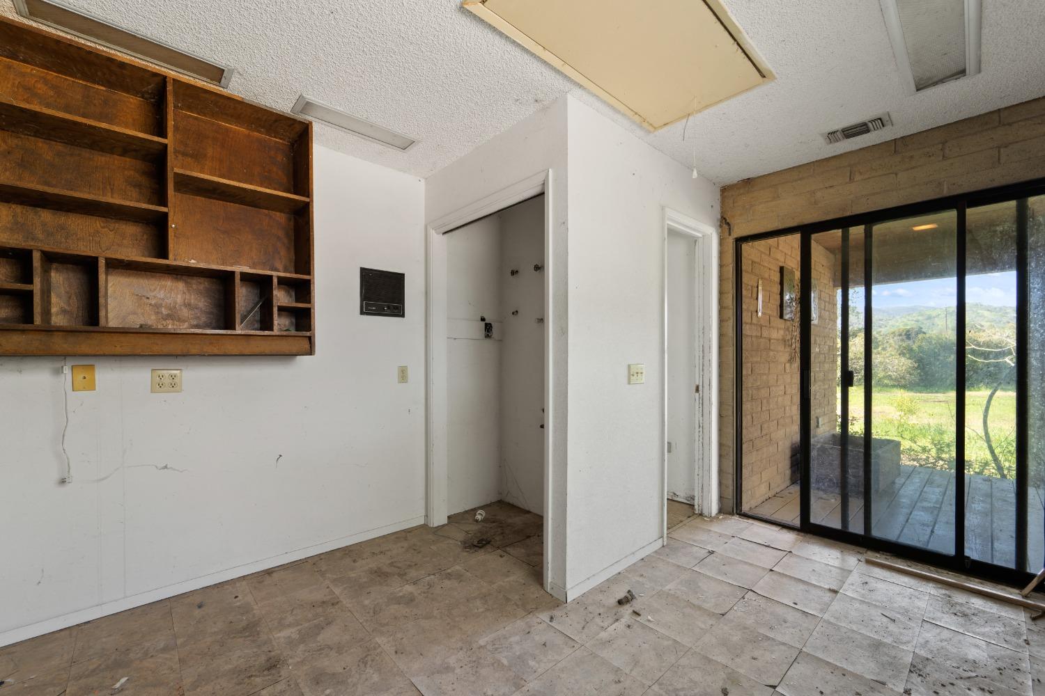15595 Highway 16 Capay, CA 95607 - Photo 32 of 68 an empty room with walk in closet and a window