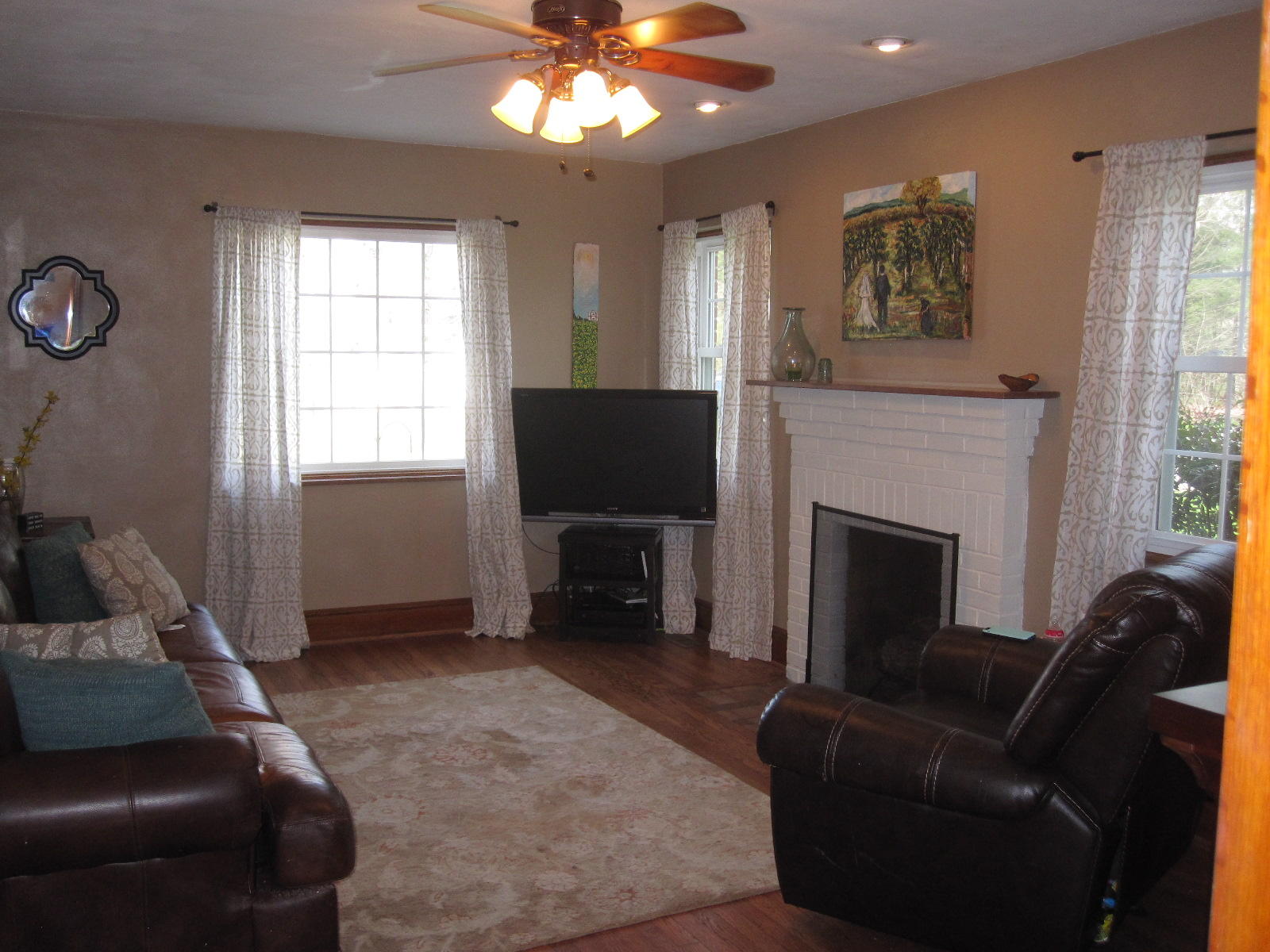 1909 Retreat Road Boones Mill, VA 24065 - Photo 44 of 59 a living room with furniture a flat screen tv and a fireplace