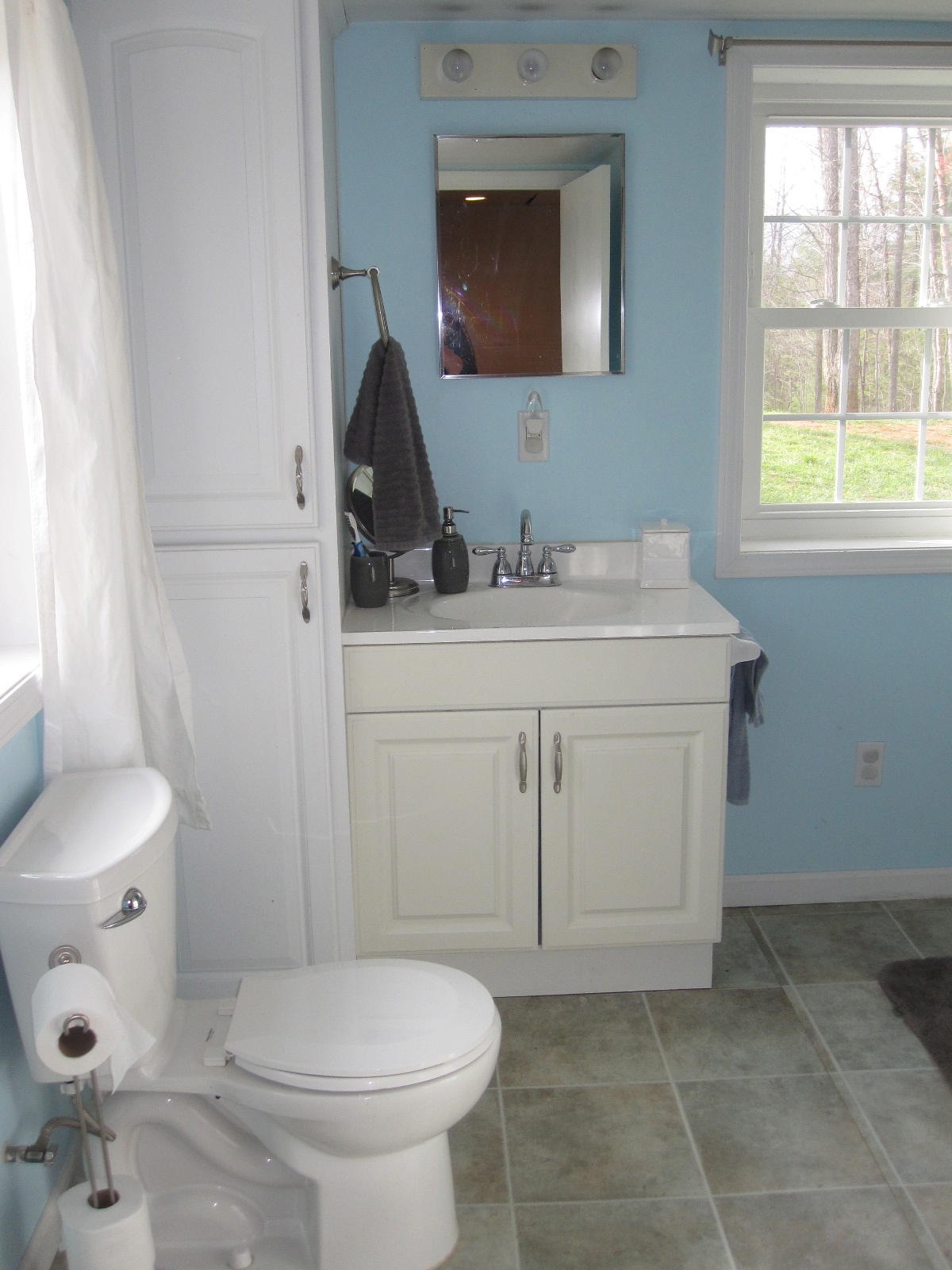 1909 Retreat Road Boones Mill, VA 24065 - Photo 56 of 59 a bathroom with a toilet sink and mirror