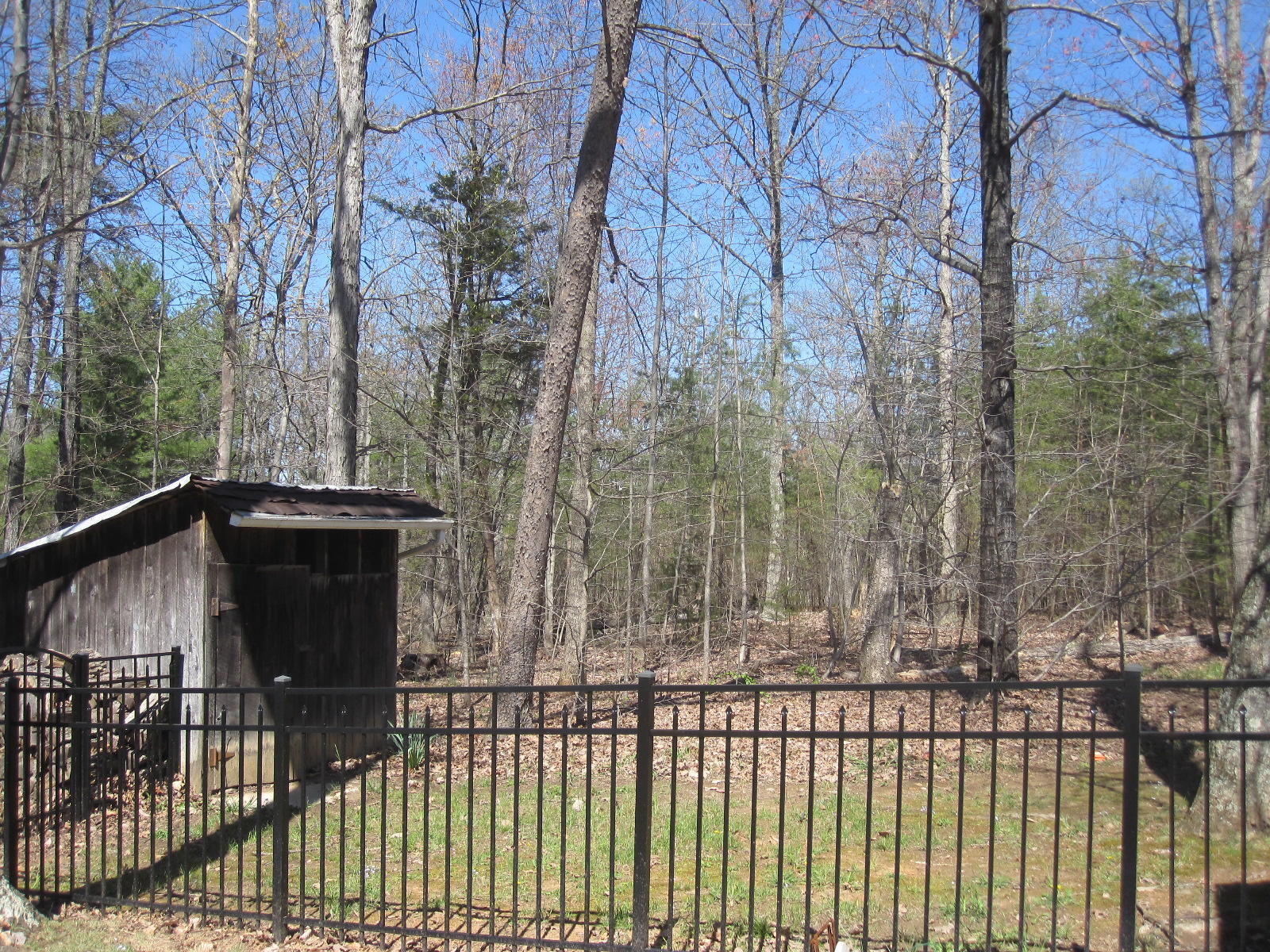 1909 Retreat Road Boones Mill, VA 24065 - Photo 9 of 59 a view of a black gate with wooden fence