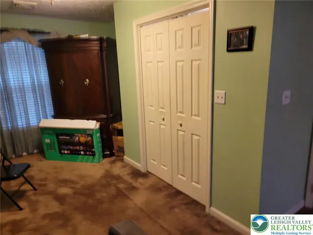 a room with furniture and flat screen tv