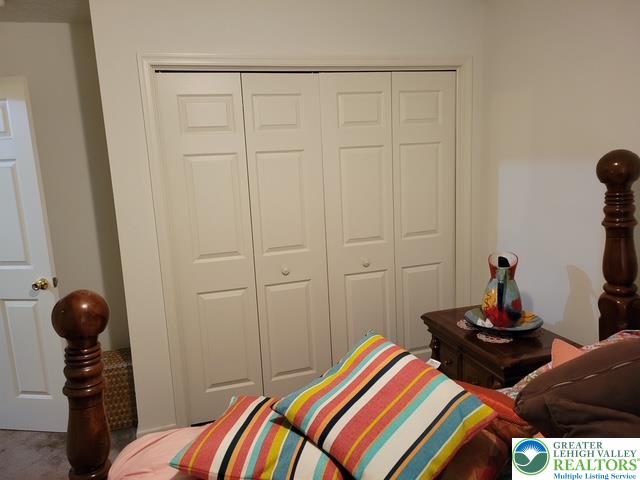 2137 Freedom Way Pocono Summit, PA 18346 - Photo 31 of 33 a bedroom with a bed and wooden floor