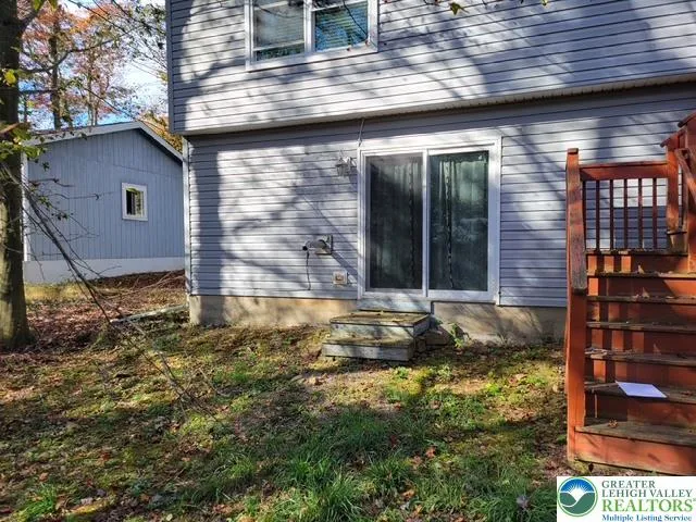 a view of a outdoor space and backyard of the house