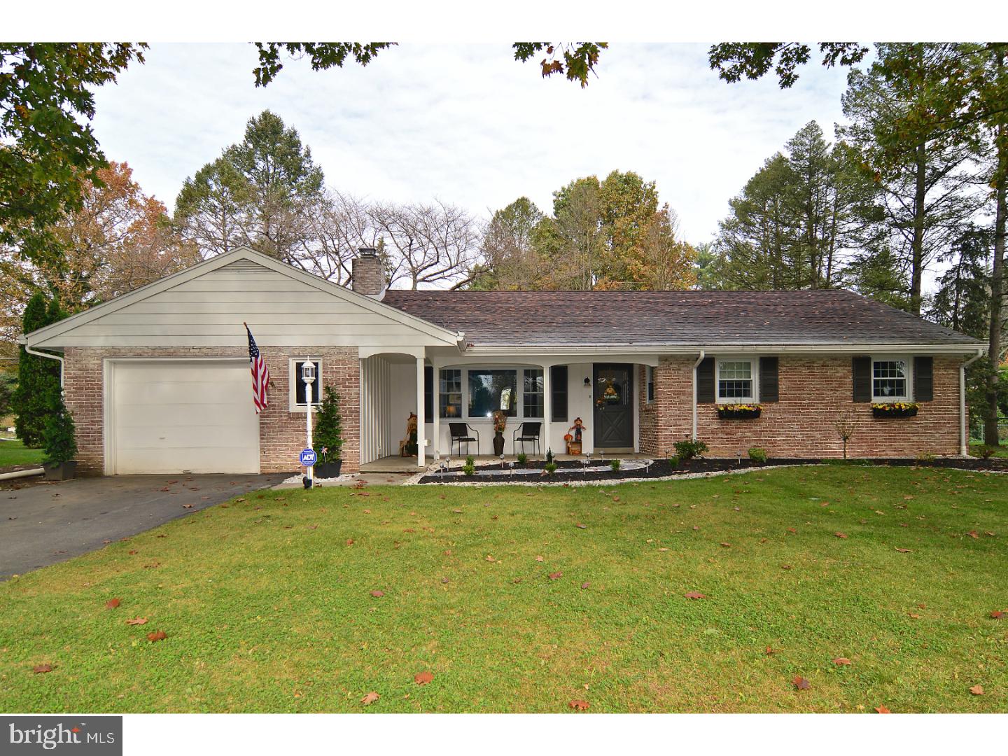 6 Wendy Road Reading, PA 19601 - Photo 1 of 24 a front view of a house with a garden and trees