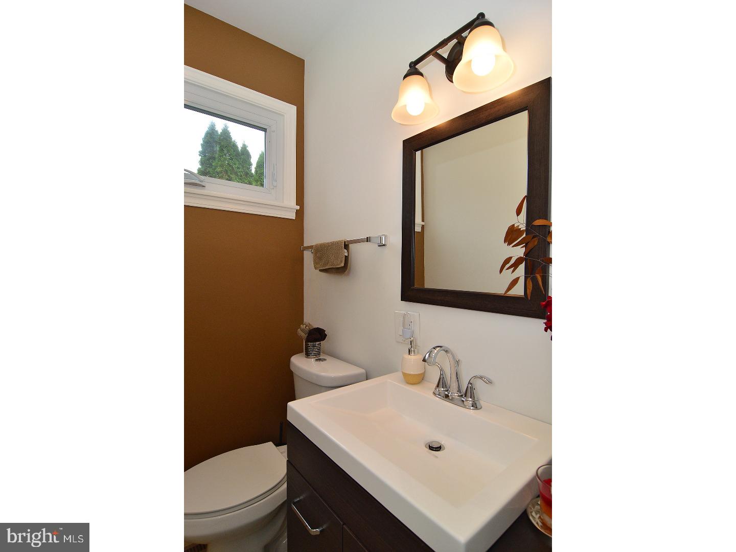 6 Wendy Road Reading, PA 19601 - Photo 13 of 24 a bathroom with a toilet sink and mirror