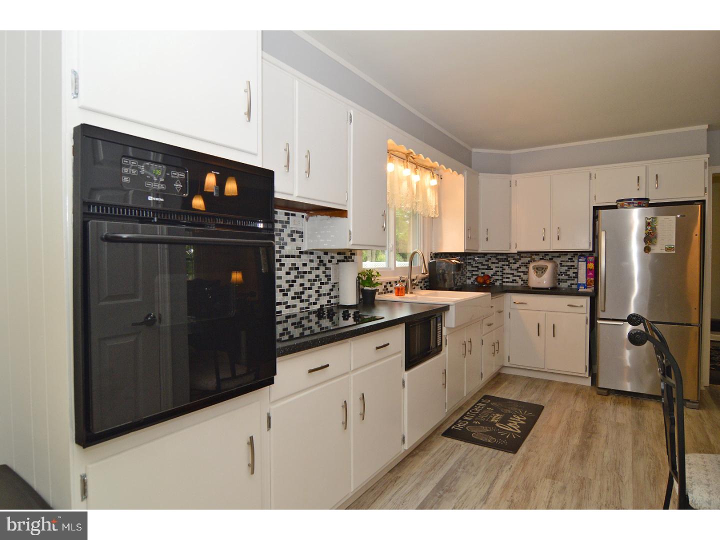 6 Wendy Road Reading, PA 19601 - Photo 10 of 24 a kitchen with granite countertop a refrigerator stove and sink