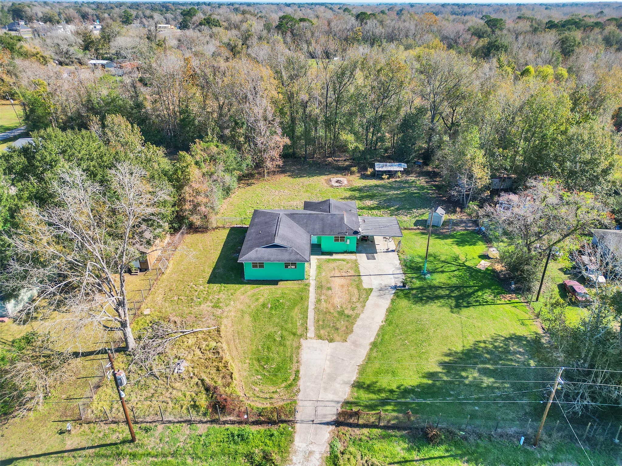 a view of yard with swimming pool and green space