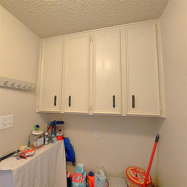 2303 Dover Road Killeen, TX 76543 - Photo 7 of 18 Laundry room with plenty of cabinet space.