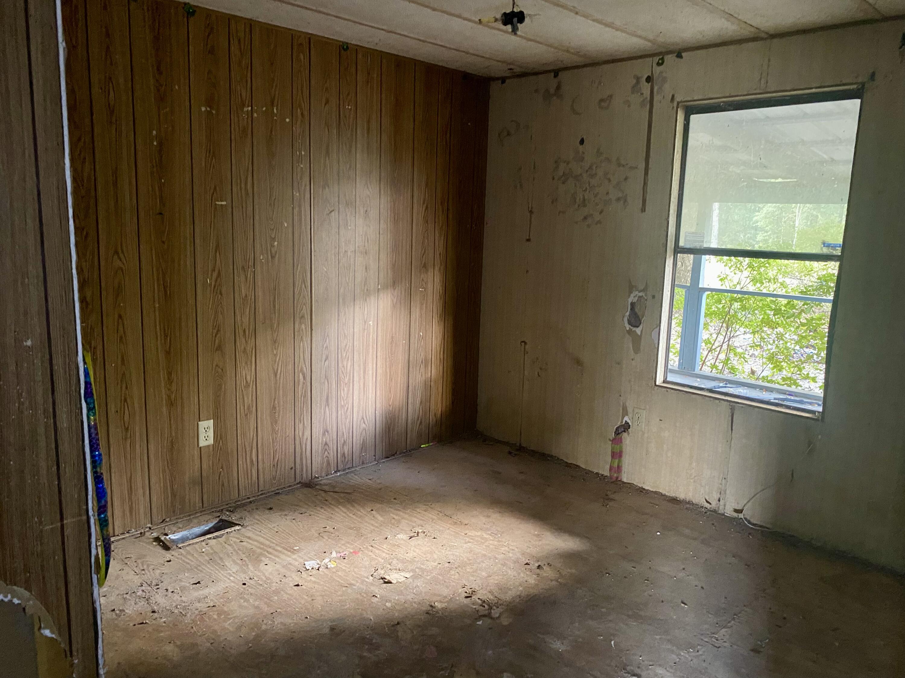 4977 Douglas Ferry Road Caryville, FL 32427 - Photo 9 of 11 an empty room with windows