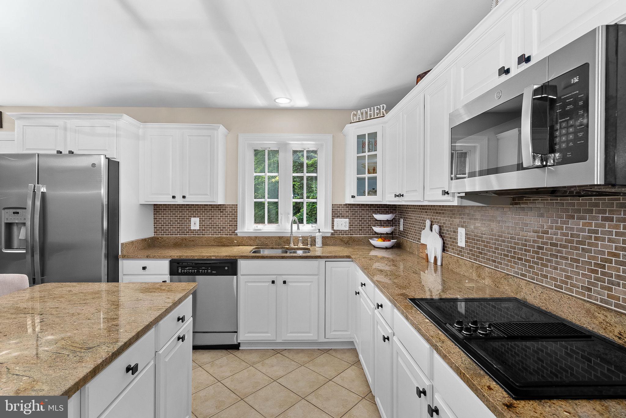 7214 Calamo Street Springfield, VA 22150 - Photo 25 of 77 Granite countertops and island