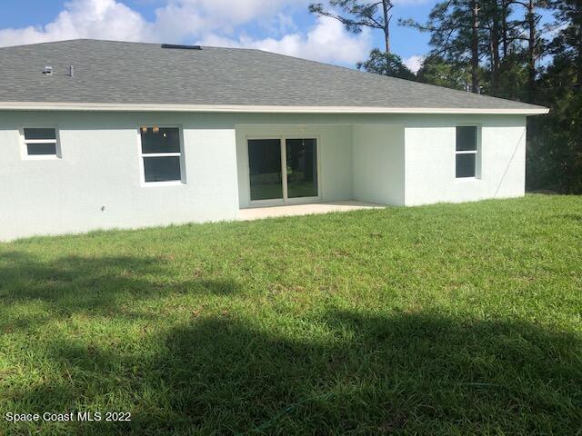 920 Pandora Road Southeast Palm Bay, FL 32909 - Photo 8 of 45 a house view with a garden space