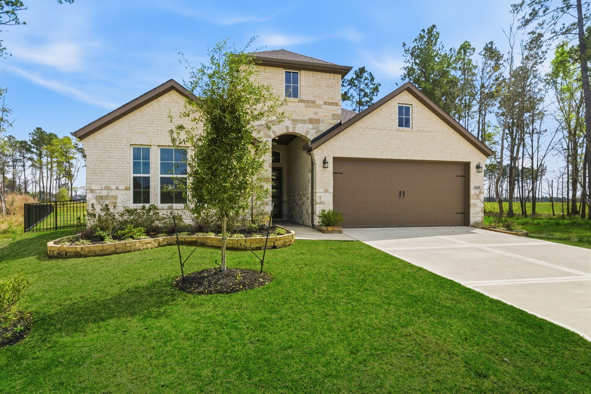 21807 Victory Green Way Porter, TX 77365 - Photo 1 of 50 a view of a house with backyard and a tree