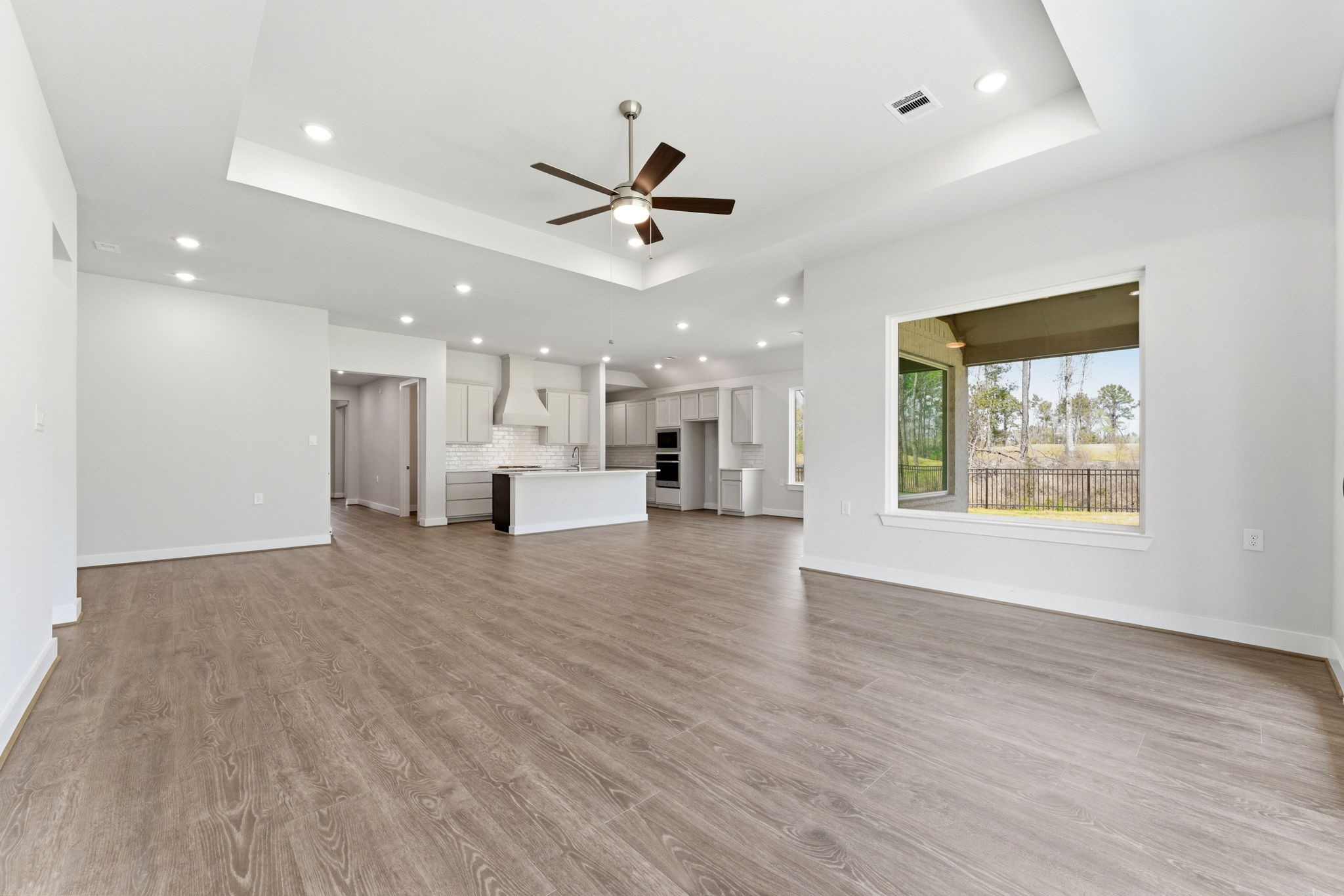 21807 Victory Green Way Porter, TX 77365 - Photo 12 of 50 a view of kitchen with furniture and a ceiling fan
