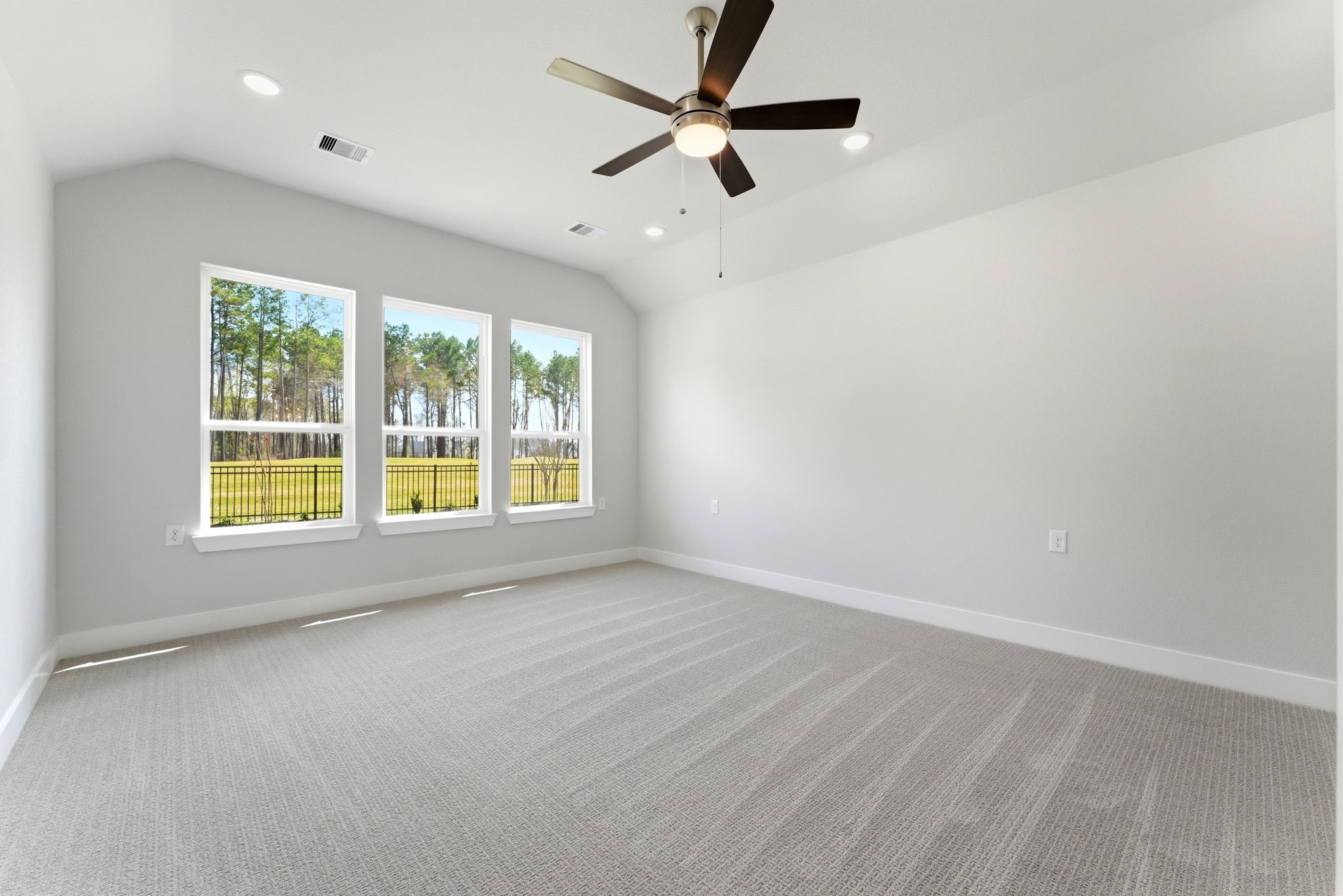 21807 Victory Green Way Porter, TX 77365 - Photo 14 of 50 an empty room with a window and a fan