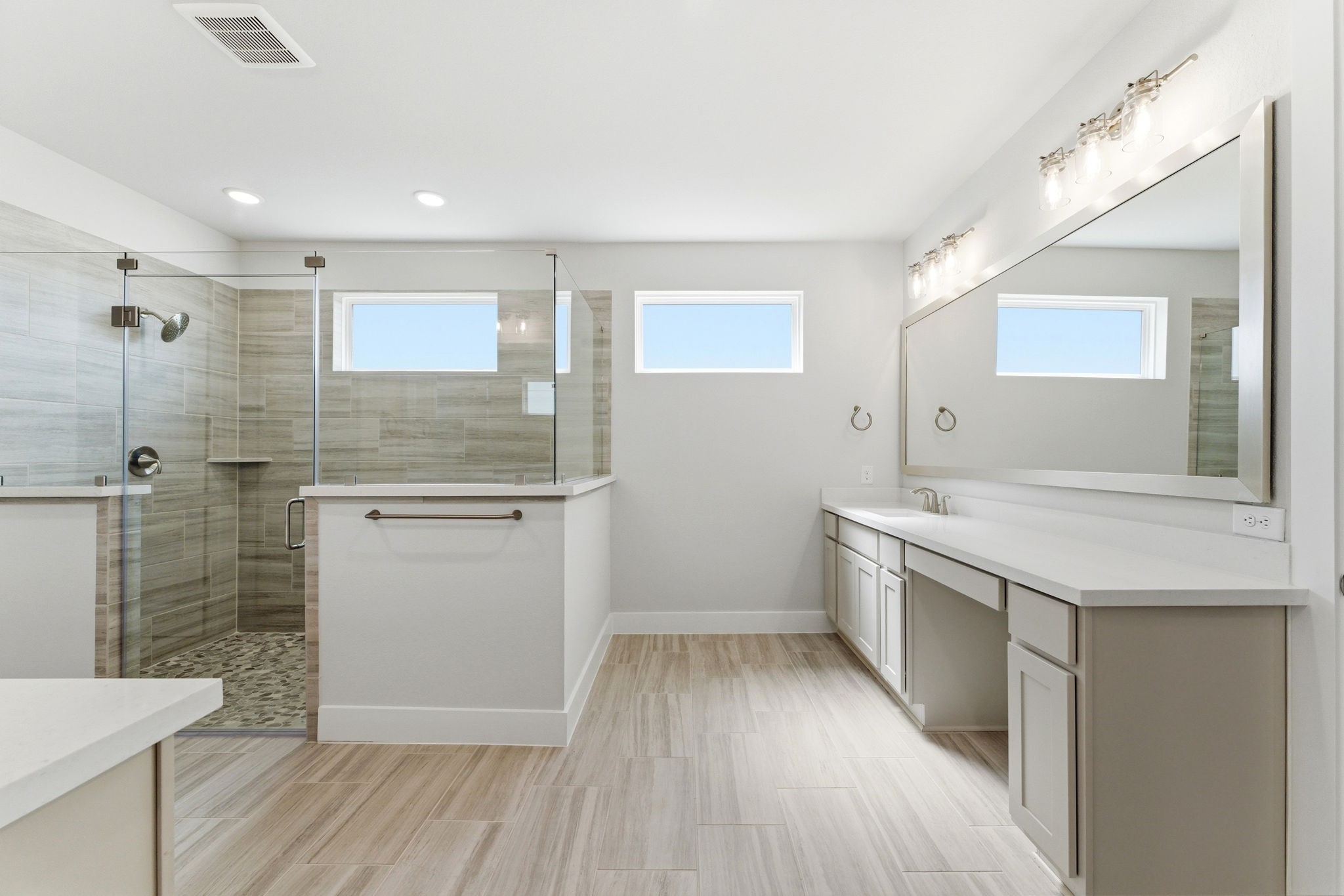 21807 Victory Green Way Porter, TX 77365 - Photo 16 of 50 a bathroom with a sink a toilet a mirror and shower