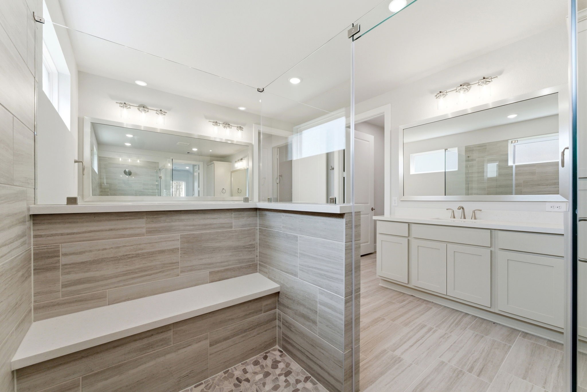21807 Victory Green Way Porter, TX 77365 - Photo 18 of 50 a bathroom with a shower sink and mirror
