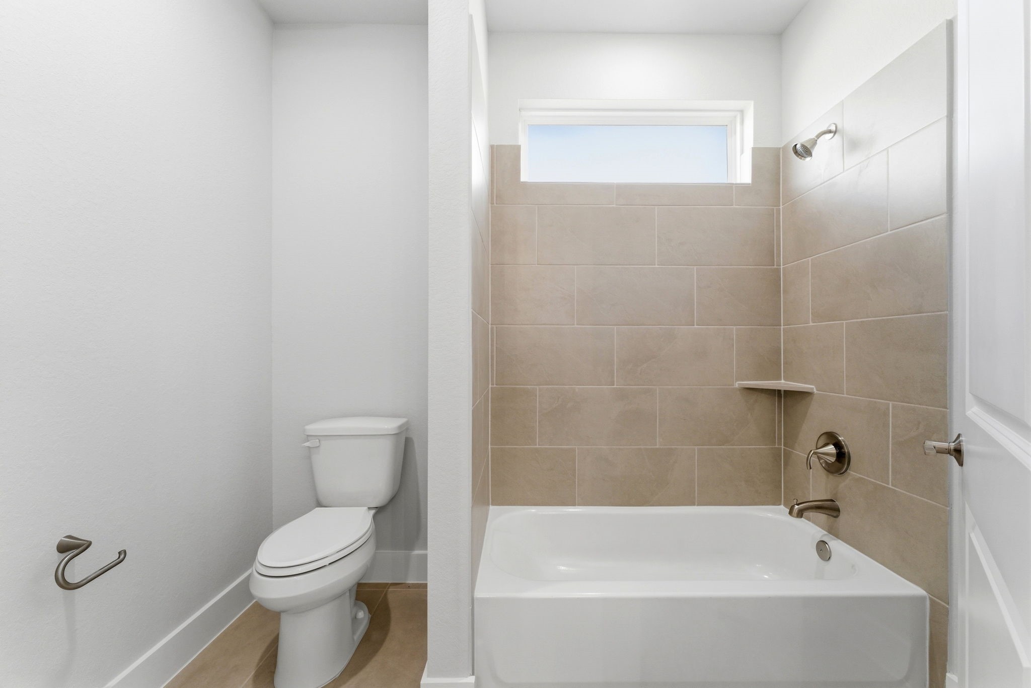 21807 Victory Green Way Porter, TX 77365 - Photo 22 of 50 a bathroom with a bathtub and toilet