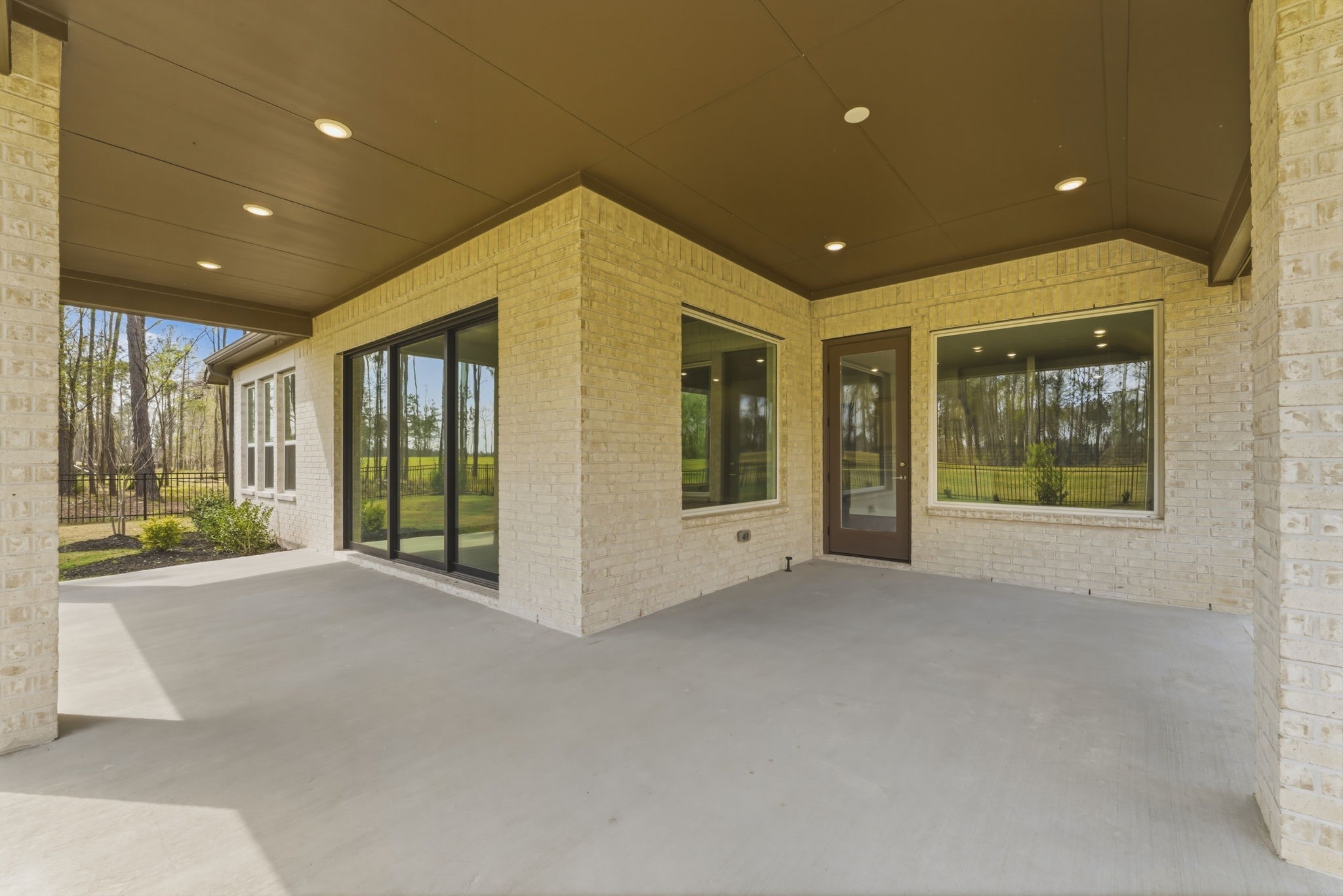 21807 Victory Green Way Porter, TX 77365 - Photo 32 of 50 a view of an empty room with a fireplace and window