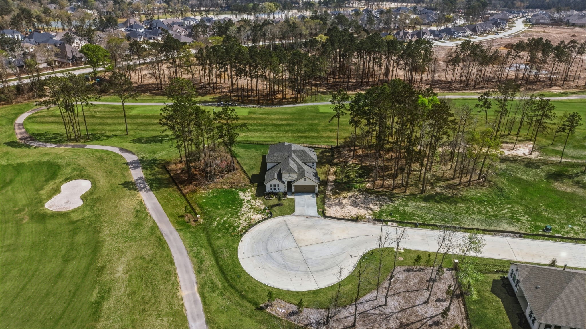 21807 Victory Green Way Porter, TX 77365 - Photo 36 of 50 a view of a swimming pool of a house with a yard