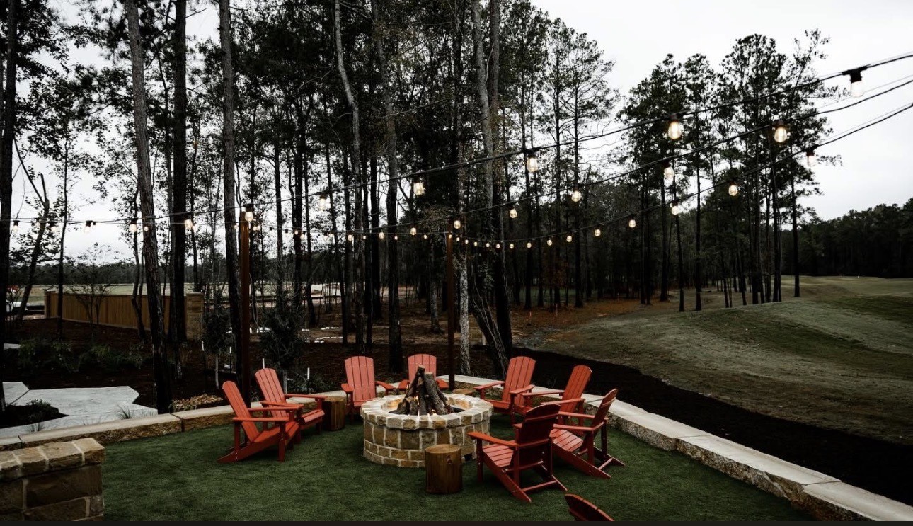 21807 Victory Green Way Porter, TX 77365 - Photo 49 of 50 a backyard of a house with fountain table and chairs