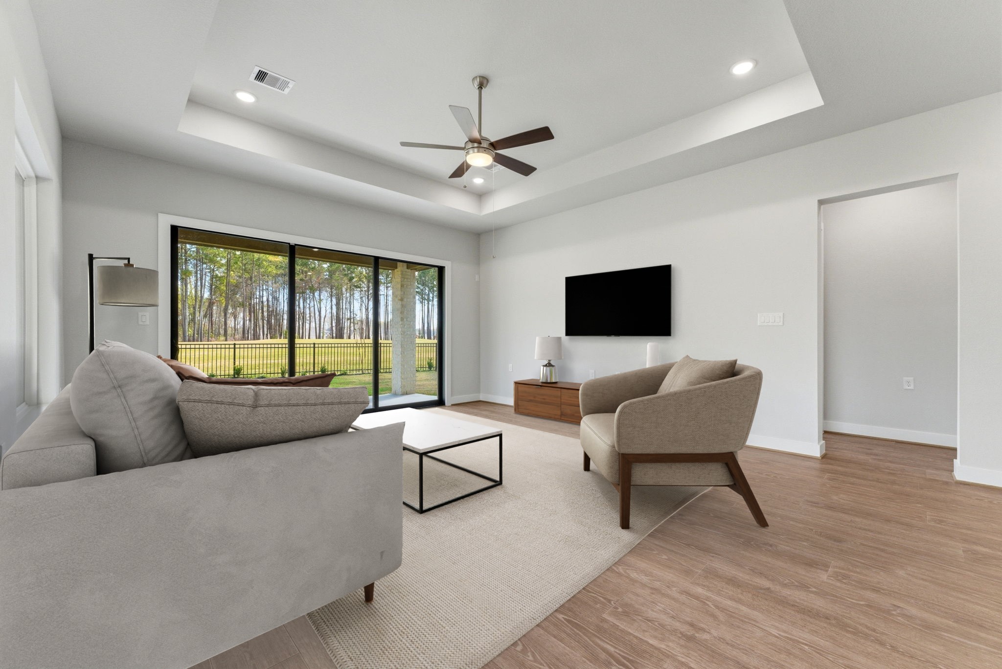 21807 Victory Green Way Porter, TX 77365 - Photo 10 of 50 a living room with furniture and a flat screen tv