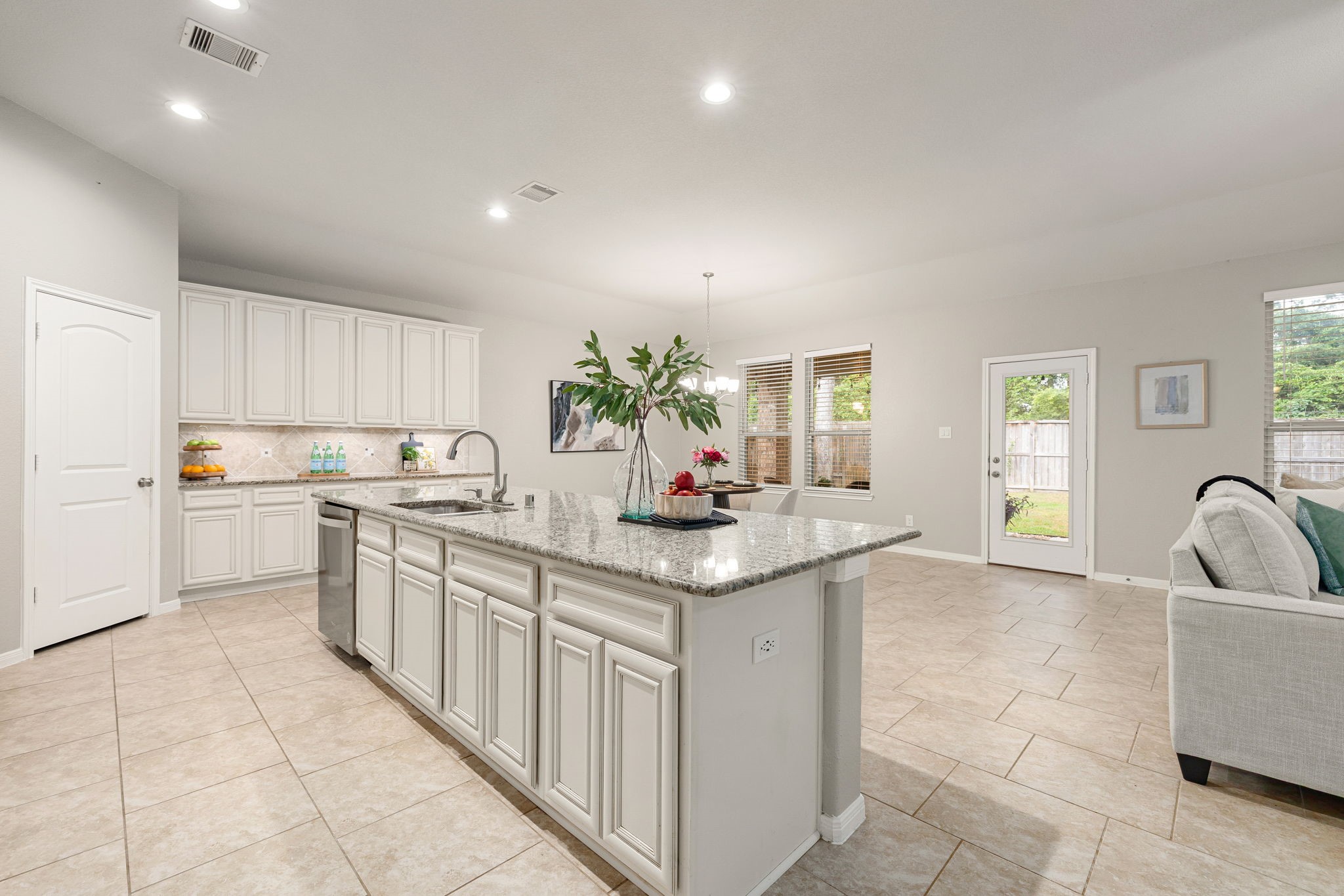 14023 Beaverhead Range Court Conroe, TX 77384 - Photo 10 of 30 The well-appointed kitchen features a wealth of stylish and functional storage options! With floor-to-ceiling cabinetry ensures plenty of room for all your culinary essentials, keeping countertops clutter-free.
