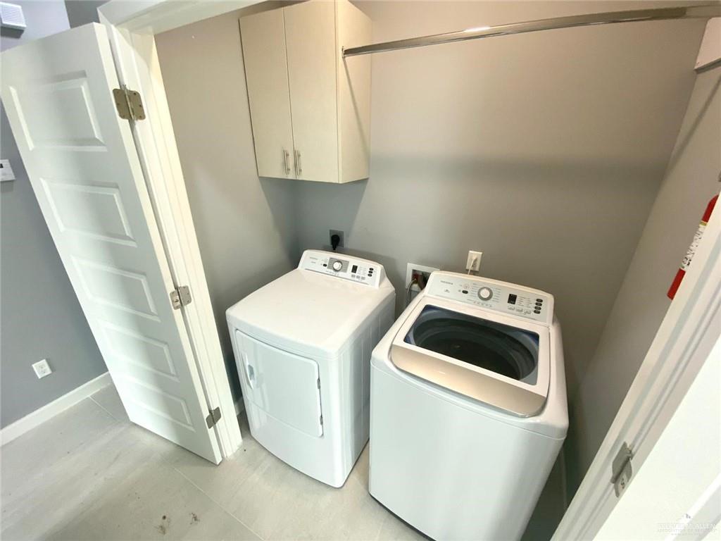 1200 West Harrison Avenue, Unit 2 Alton, TX 78573 - Photo 11 of 11 a utility room with dryer and washer