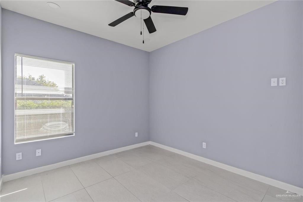 1200 West Harrison Avenue, Unit 2 Alton, TX 78573 - Photo 8 of 11 a view of an empty room with a window