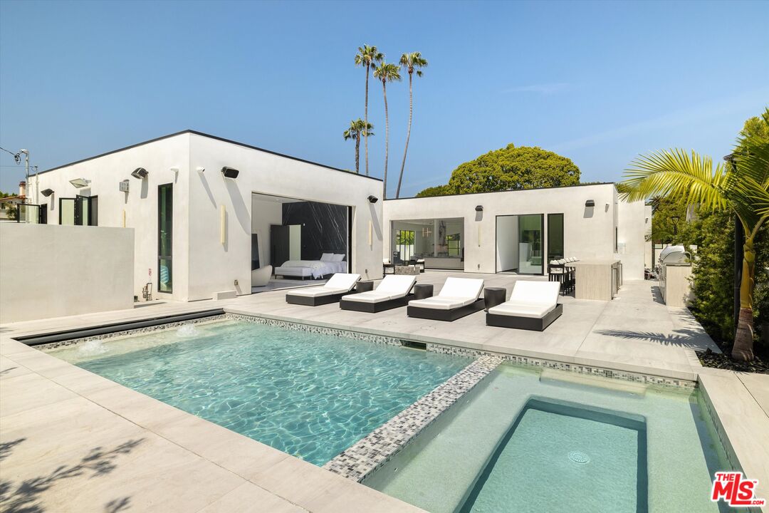 621 North Rodeo Drive Beverly Hills, CA 90210 - Photo 24 of 28 a view of a house with backyard porch and sitting area