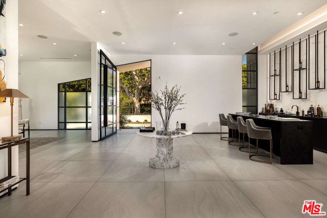 621 North Rodeo Drive Beverly Hills, CA 90210 - Photo 3 of 28 a lobby with furniture and floor to ceiling window