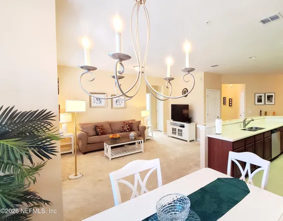 a living room with furniture fireplace and rug