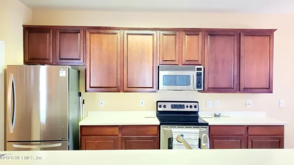 a white toilet sitting next to a shower curtain