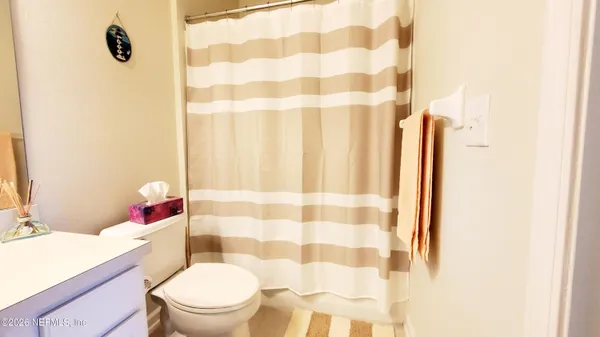 a bathroom with a double vanity sink mirror and double