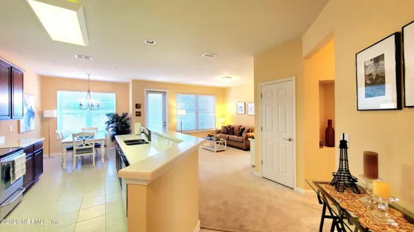a view of a livingroom with furniture and a flat screen tv