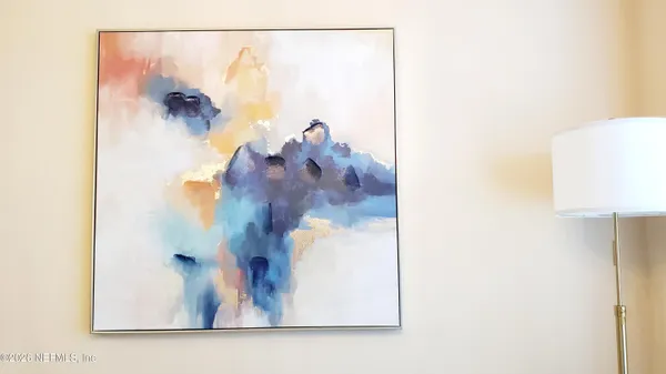 a view of a livingroom with furniture and front door