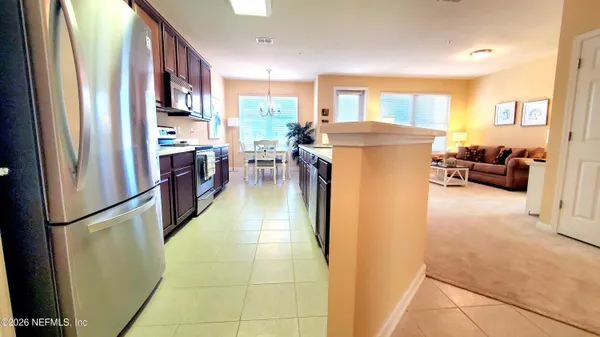 a kitchen with a sink a stove and cabinets