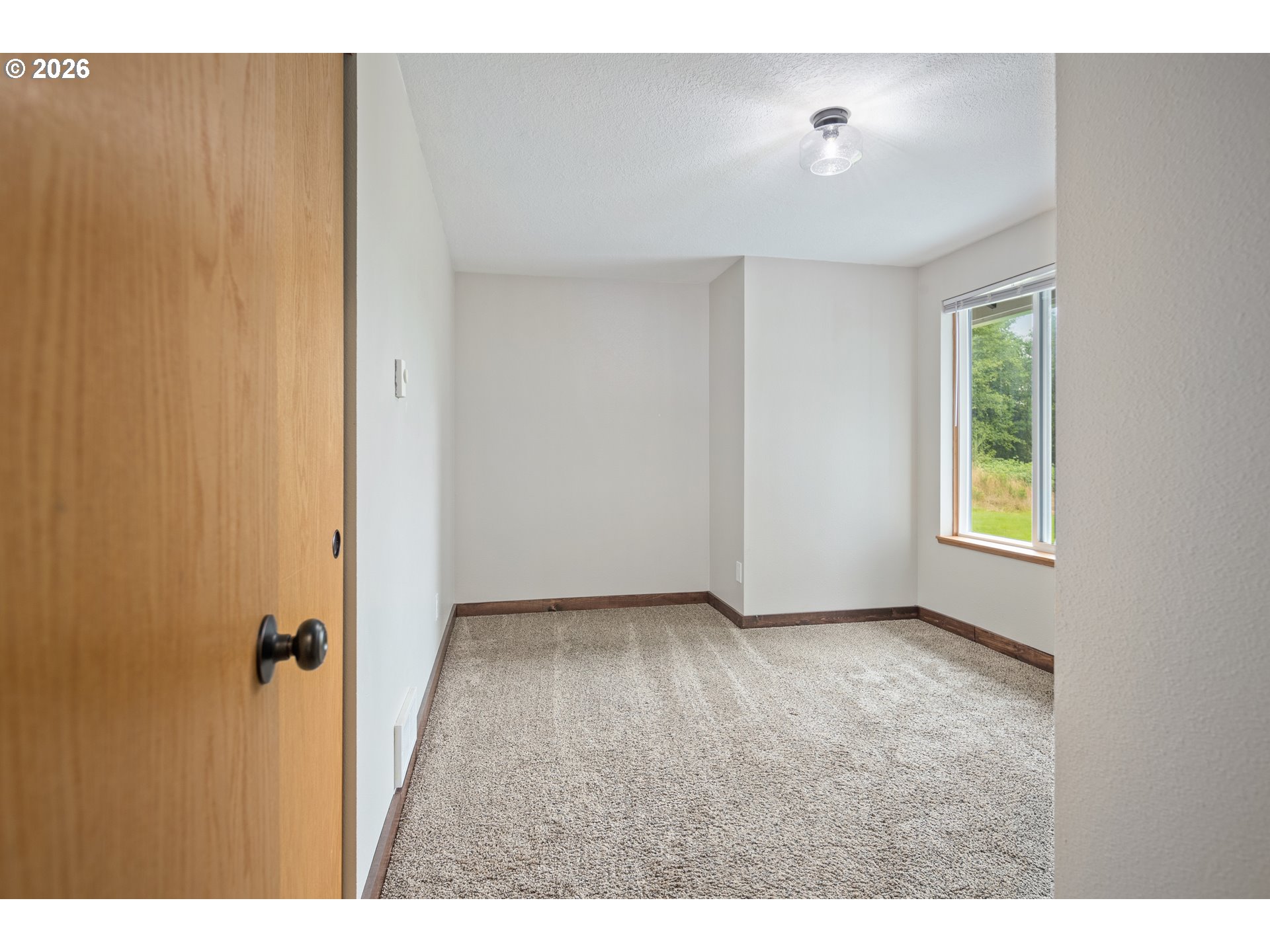 650 Marvin Road Tillamook, OR 97141 - Photo 32 of 48 a view of an empty room with a window