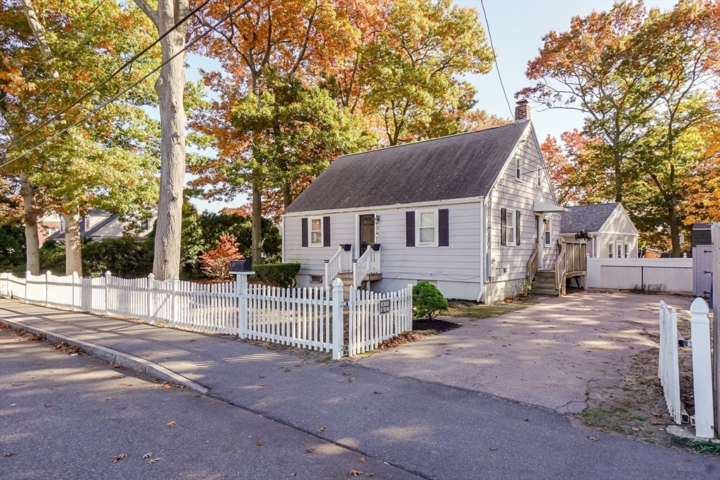 5 Oliver Street Randolph, MA 02368 - Photo 1 of 29 a house that has a tree in front of it