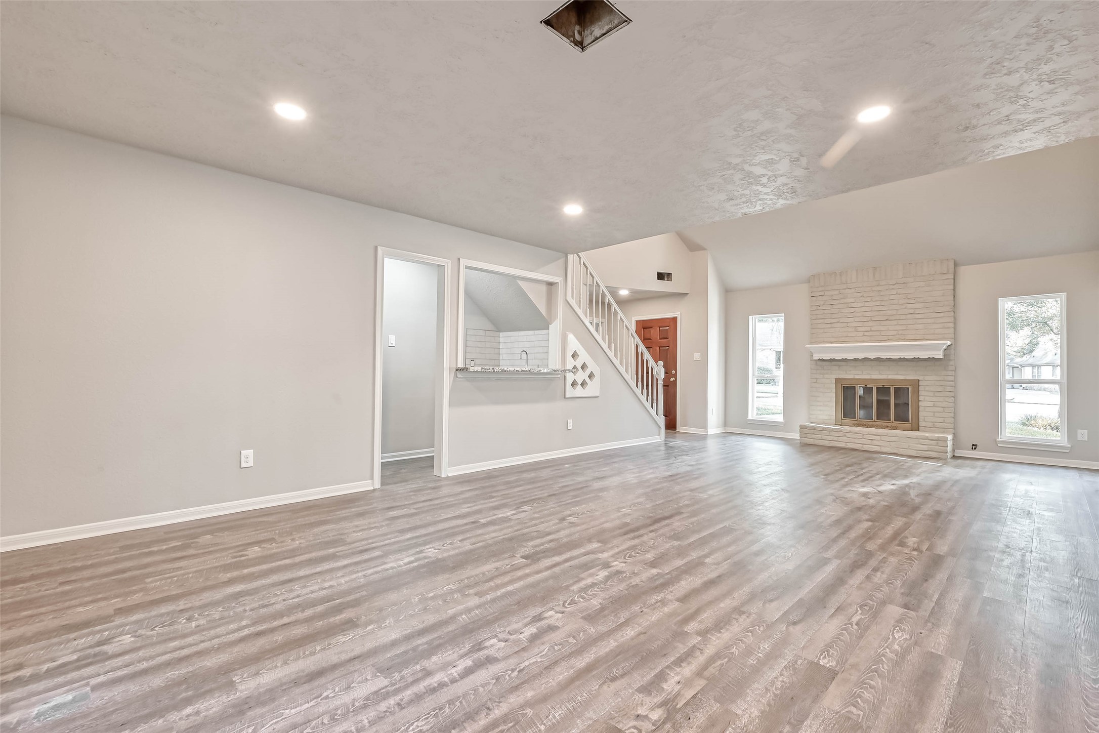 3615 Highfalls Drive Houston, TX 77068 - Photo 13 of 45 a view of empty room with wooden floor and fireplace