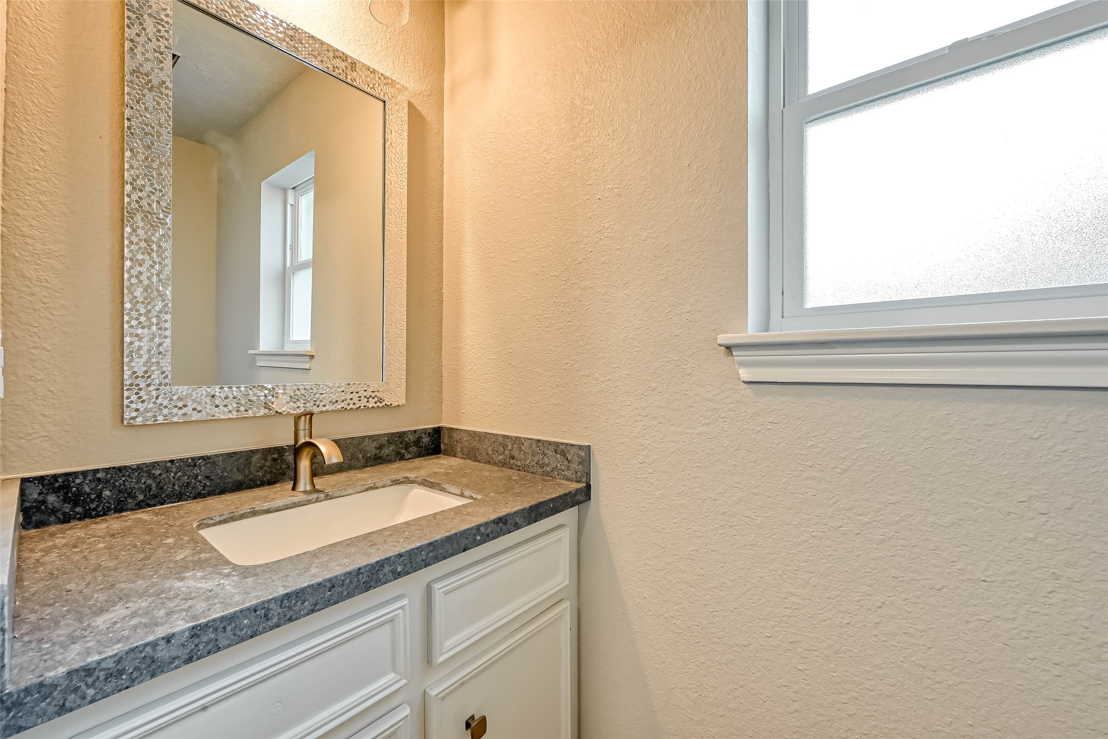 3615 Highfalls Drive Houston, TX 77068 - Photo 25 of 45 a bathroom with a granite countertop sink and a mirror